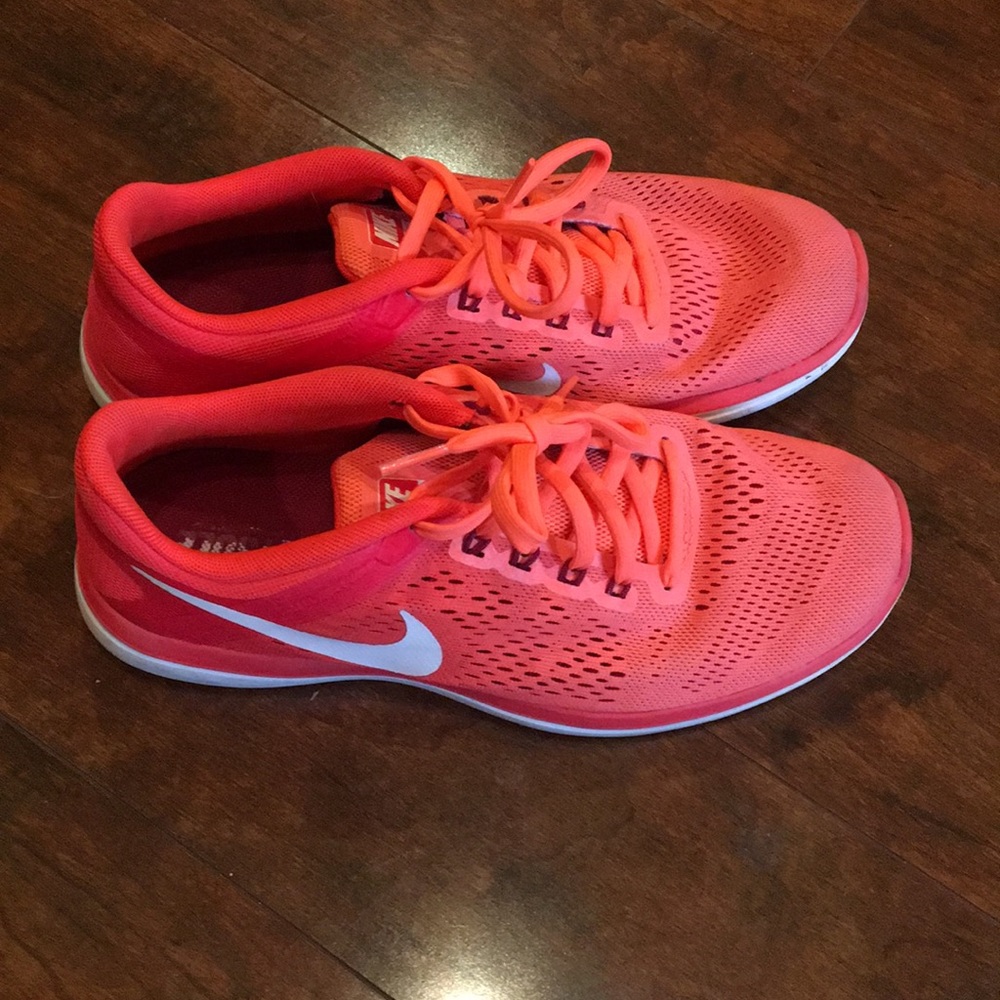 Bright orange Nike tennis shoes